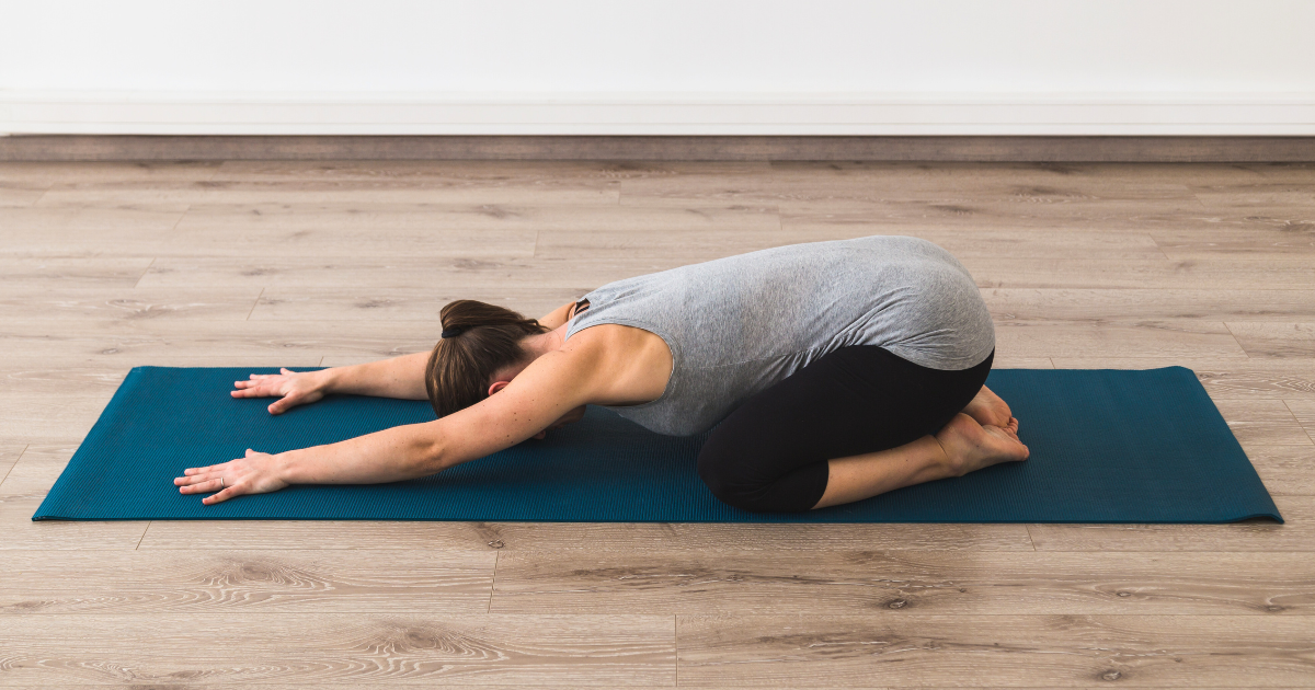 a girl relaxing in child's pose