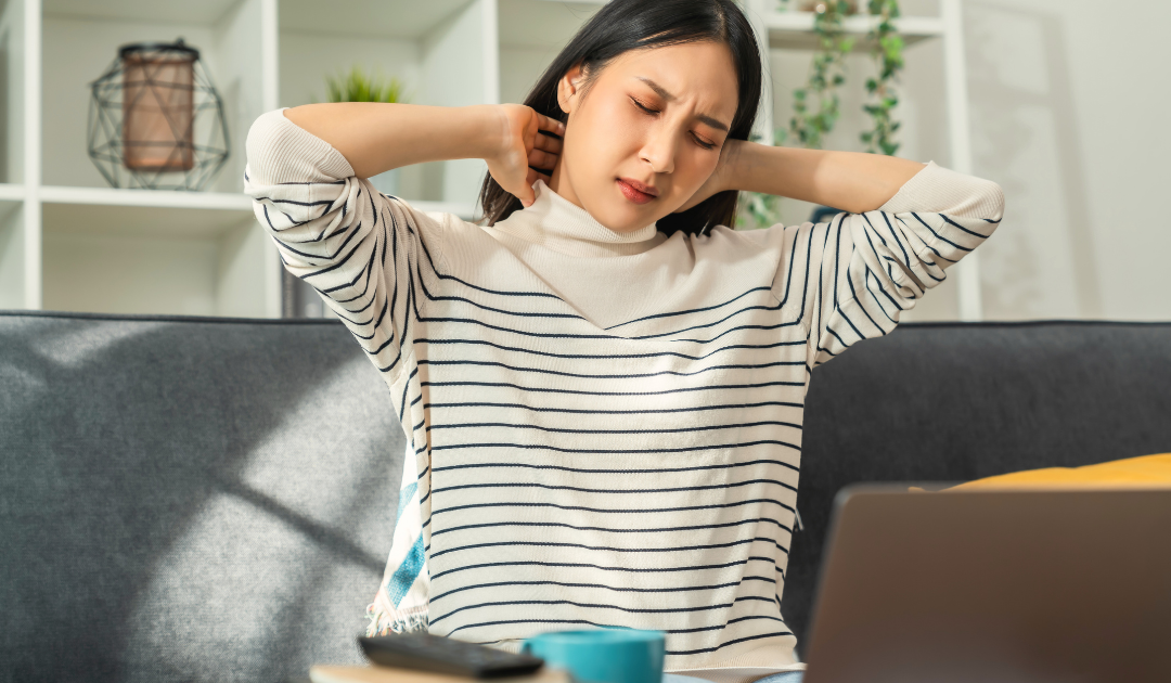 a girl experiencing neck pain