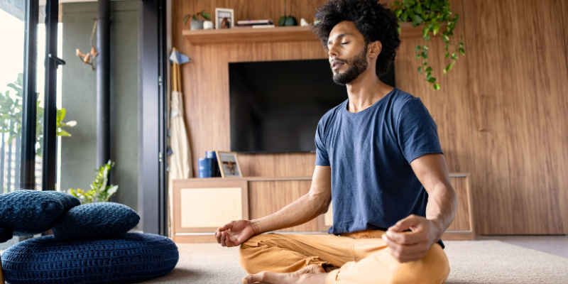 a man meditating at home
