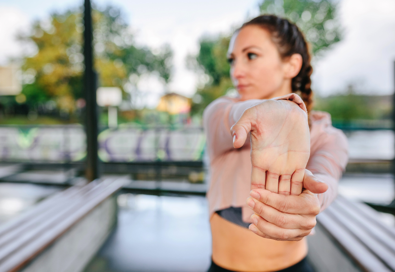 a girl stretching her hands and wrists