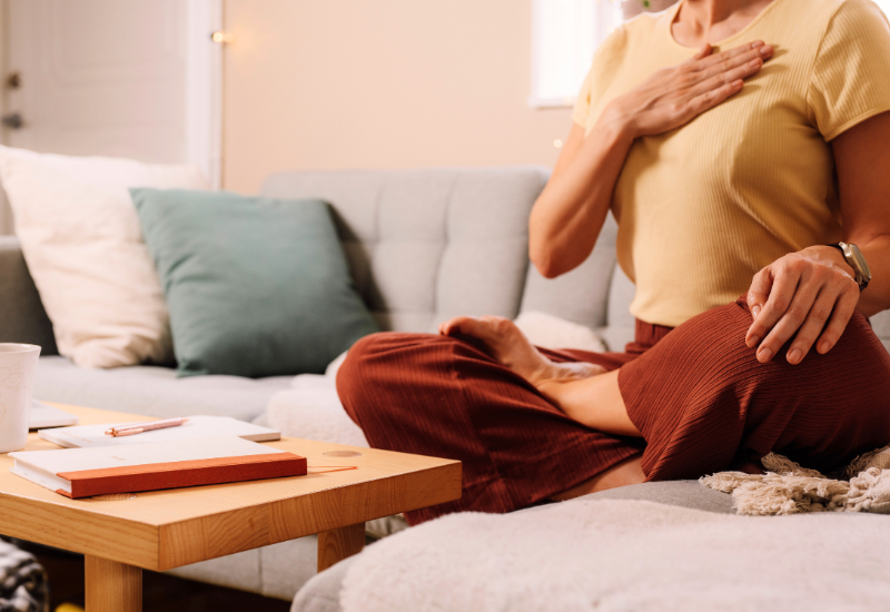 a woman doing breathwork and meditation