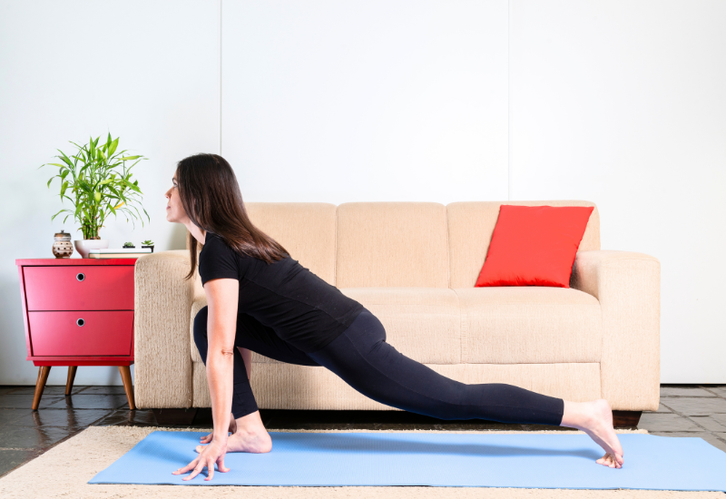 a girl doing equesterian yoga pose