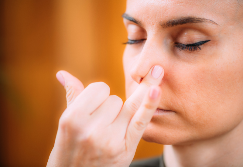 a girl doing alternate nostril breathing technique