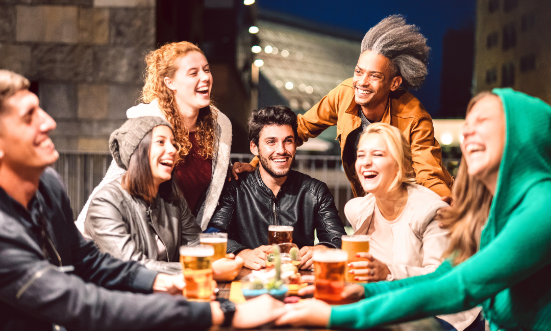 a group of young people drinking alcohol