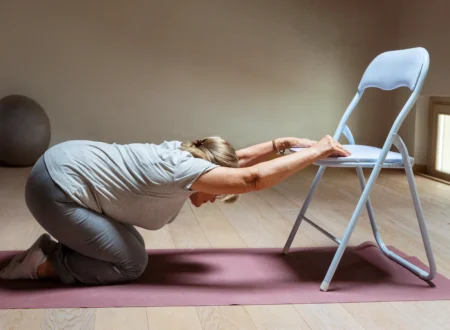 old woman doing chair yoga