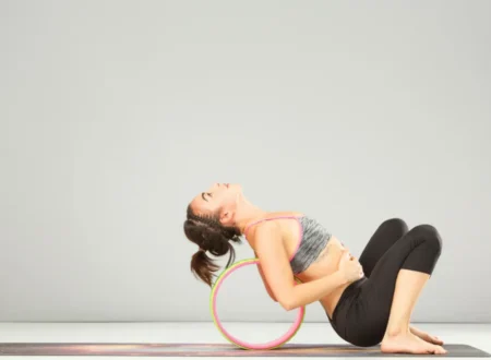 a girl doing seated backbend
