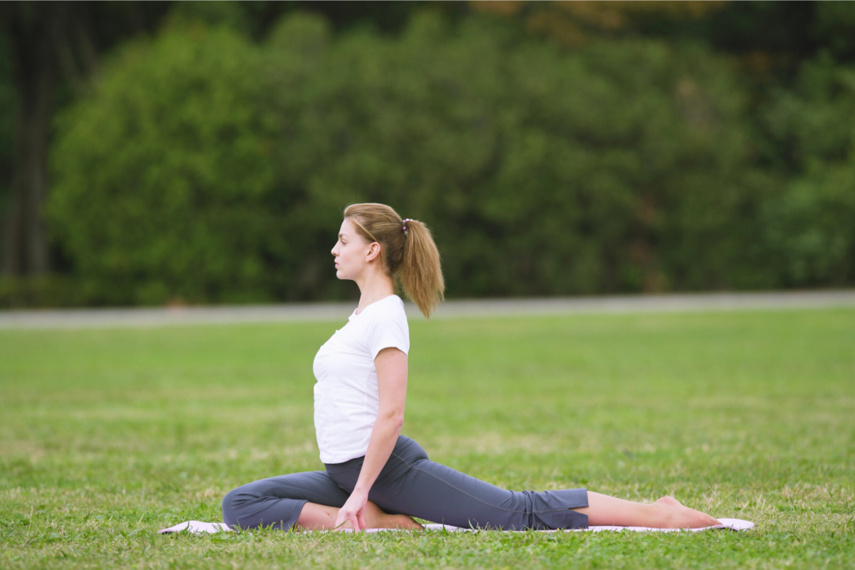 a girl doing pigeon pose
